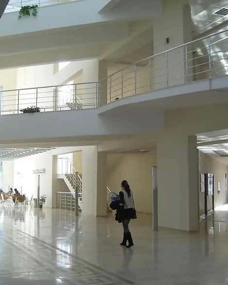 Tiered seating configuration and ceiling systems in lecture hall