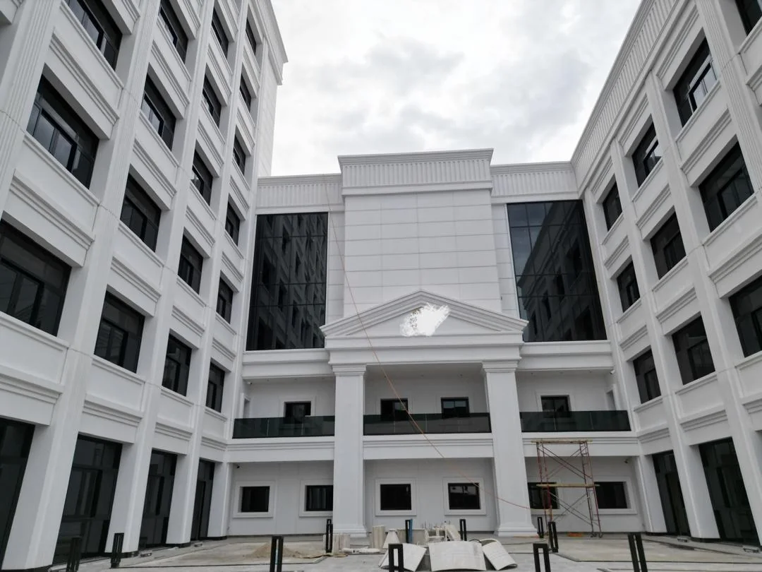 Courtyard panoramic view: Neoclassical pediment, porticos, and symmetrical curtain wall wings