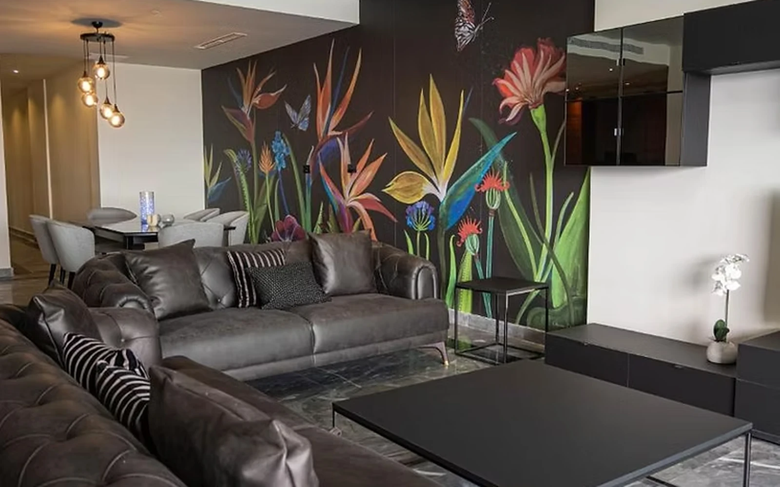 Expansive living area with custom furniture fit-out and polished marble flooring