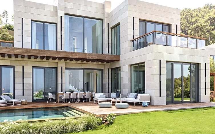 Swimming pool ceramic tiling and sun terrace overlooking Cennet Bay